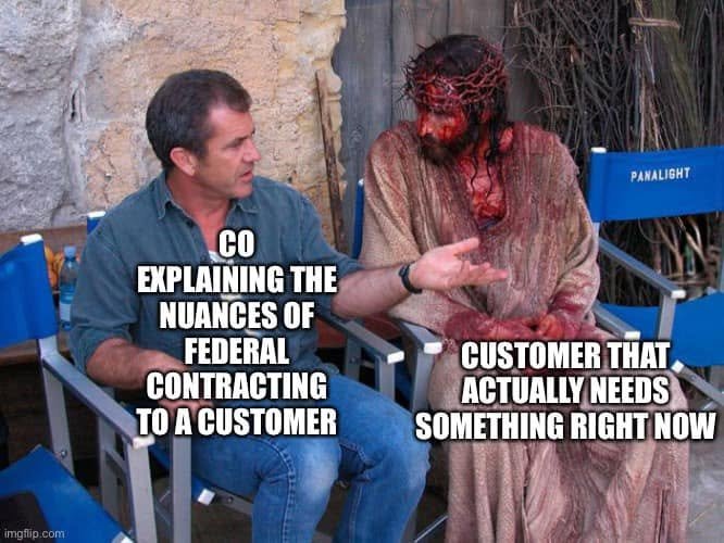 Film-set conversation: a man labeled CO explaining federal contracting nuances talks to a bloodied costumed actor labeled customer who needs something right now.