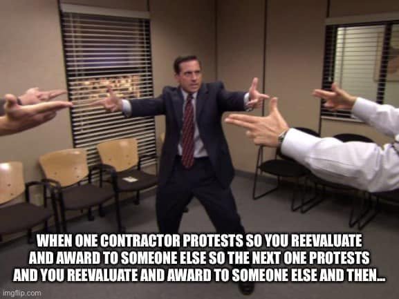 The Office finger-gun standoff captioned with an endless cycle of contractor protests, reevaluations, and new awards.